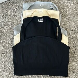 3 BRAND NEW OQQ Bodysuits.